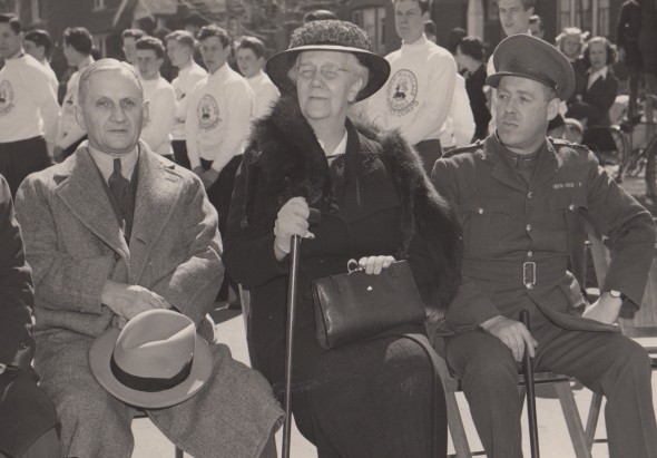 “Presentation of the ambulance and a cheque for $200 took place at Leaside School on Thursday, April 10, 1941. Chief Inspector W.K. Green (eft) presented the ambulance to Lieutenant-Colonel Drury (right) and Mrs. Reece (centre) presented the cheque to the British War Victims Fund.”